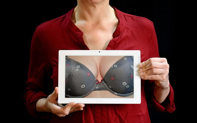 Woman Holding Picture of Bra