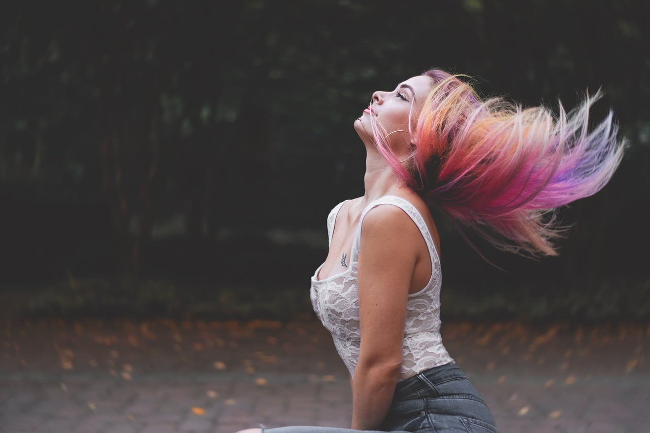 Woman flaunting rainbow colored hair