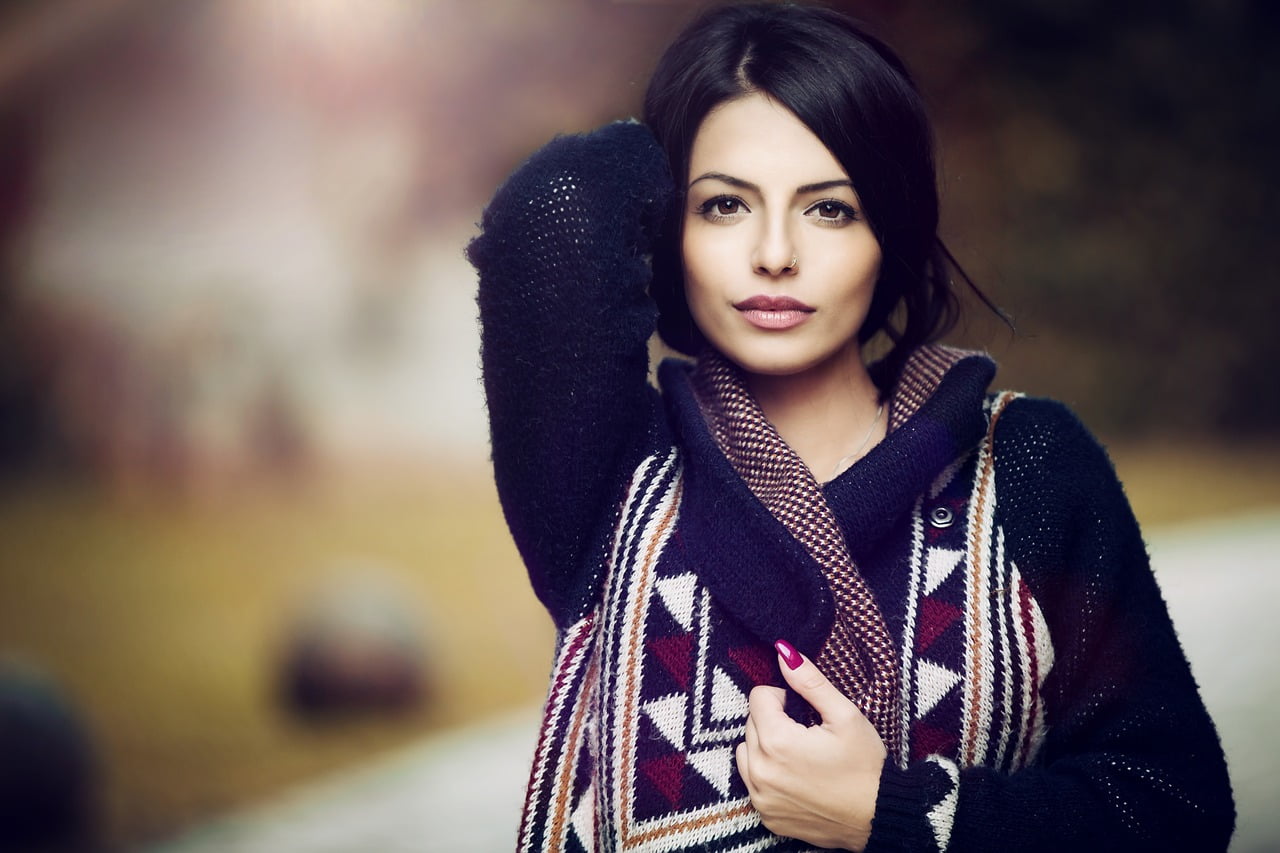 brunette woman standing foreground