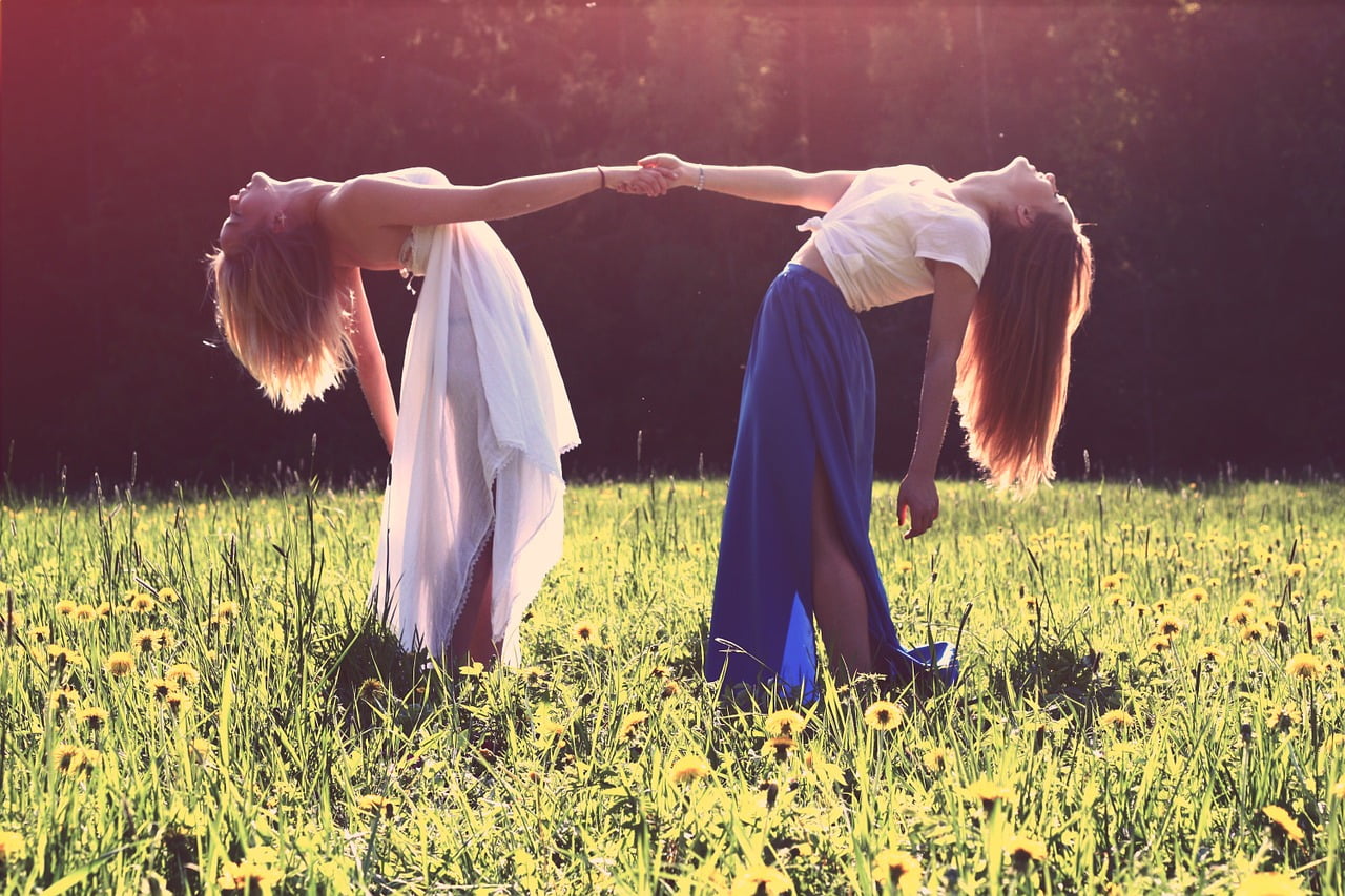 two girls holding hands