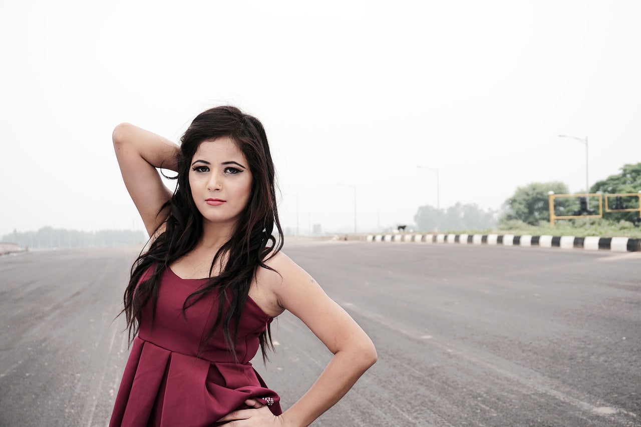 woman red dress in road