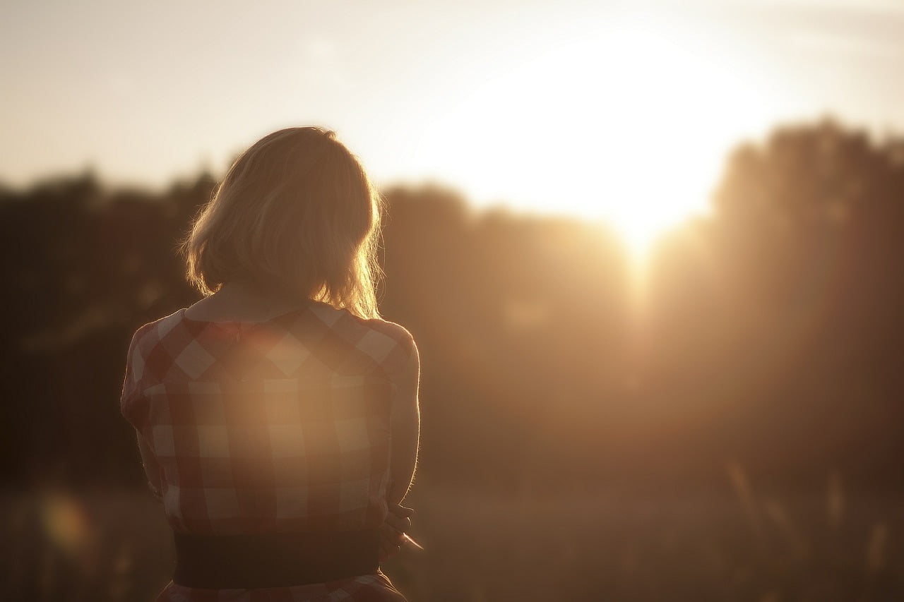 woman outside sunset