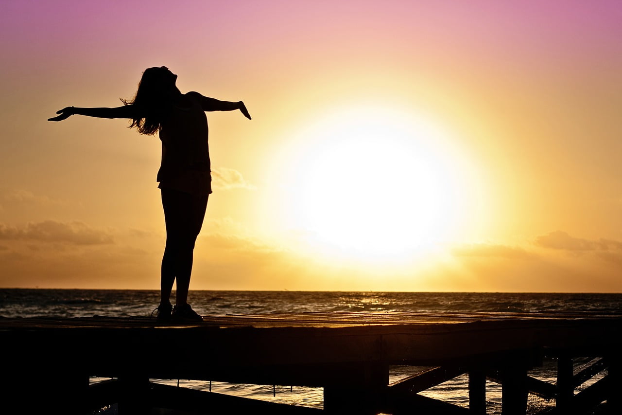 woman sunset beach