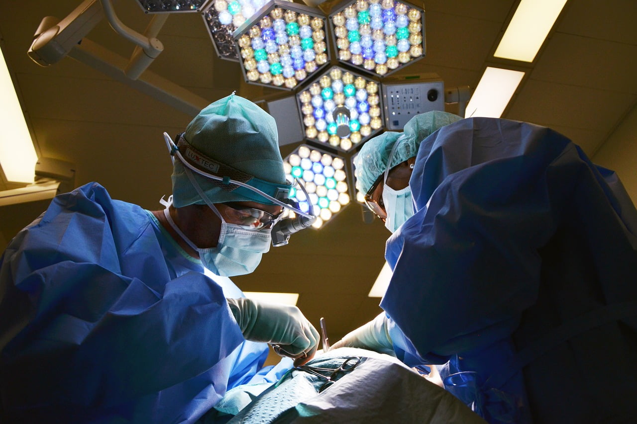 surgeons operating under lights