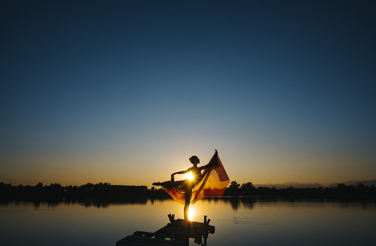 woman sunset lake