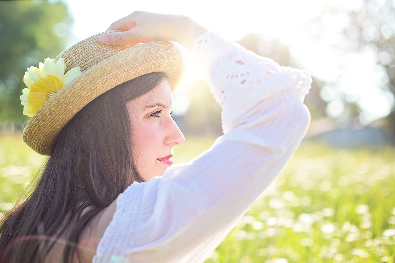 woman in sun hat in field