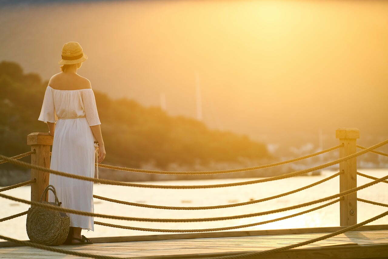 woman on pier near water