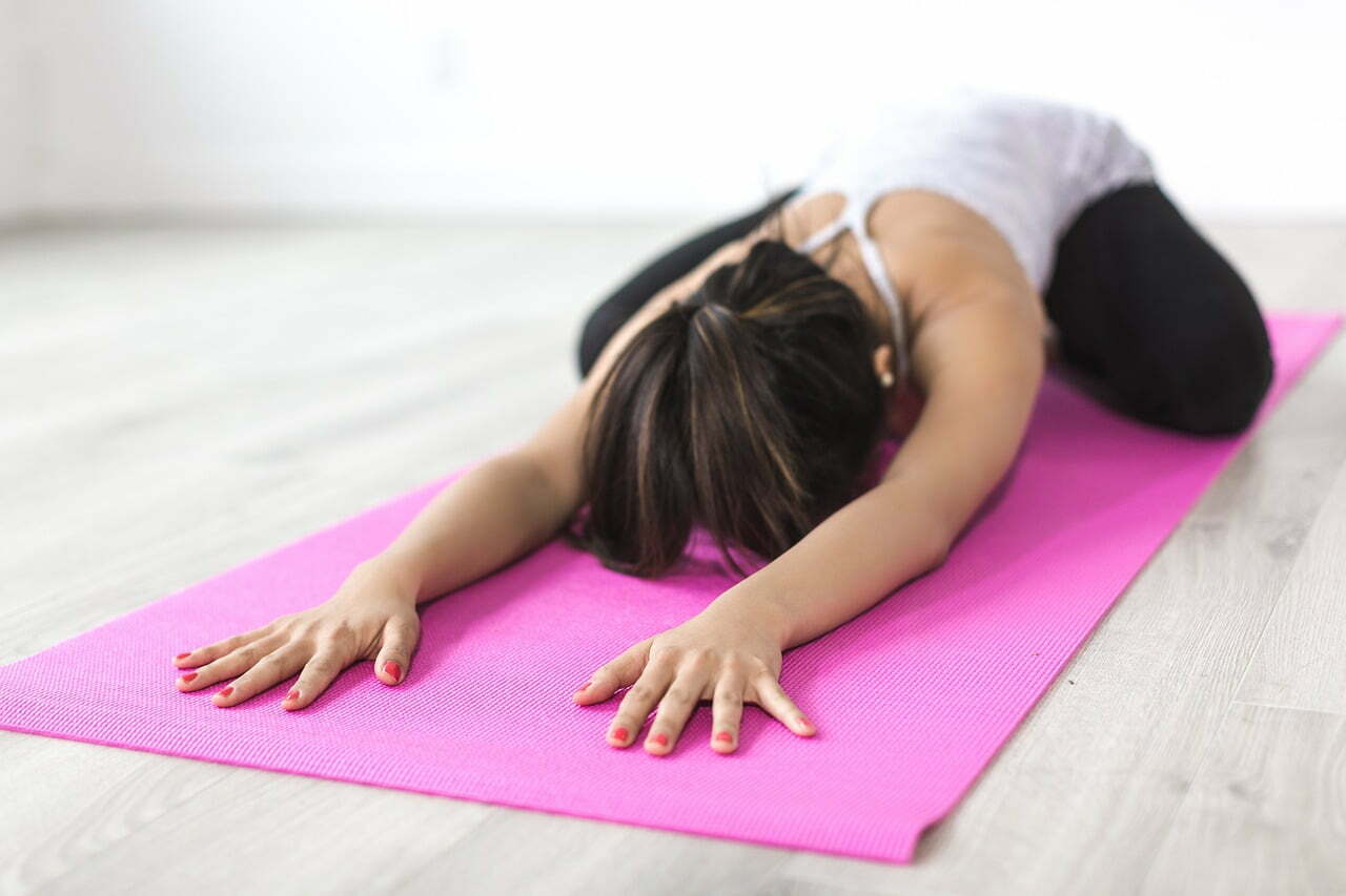 woman yoga pink mat