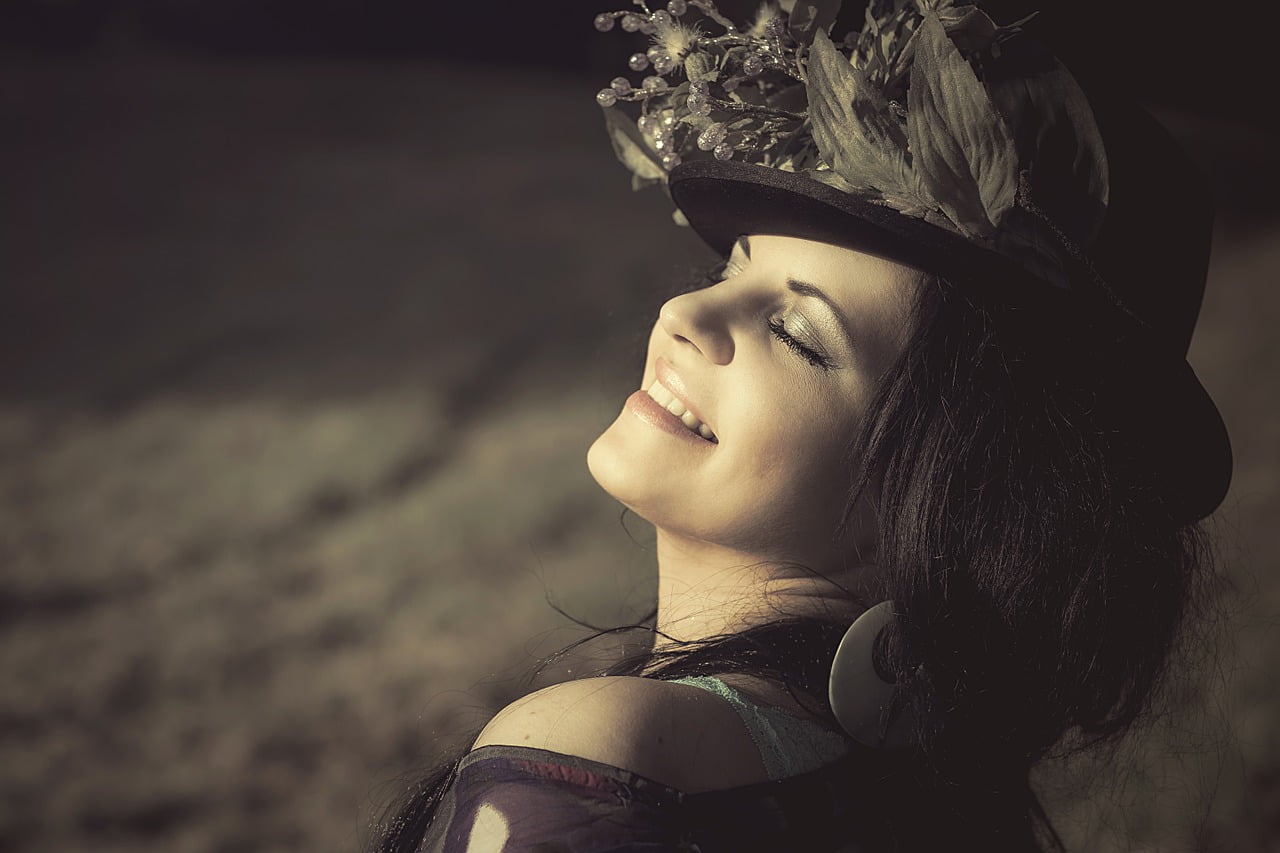 woman smiling in hat