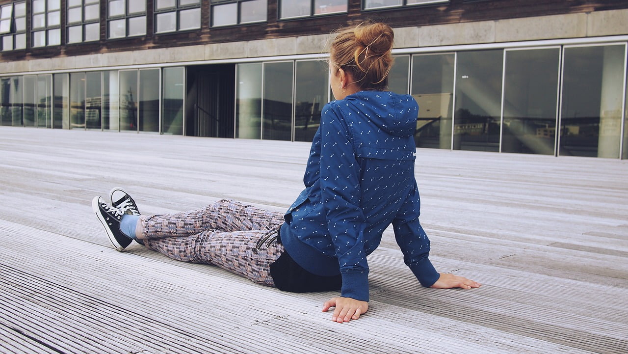 girl sitting on ground