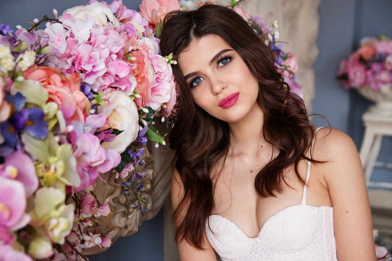 woman smiling with flowers