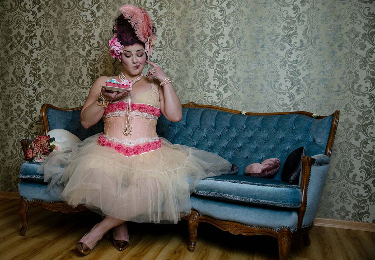 Overweight woman sitting in lingerie