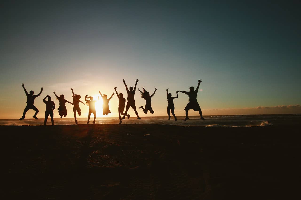 Actualizing goals, a group is jumping toward the sky