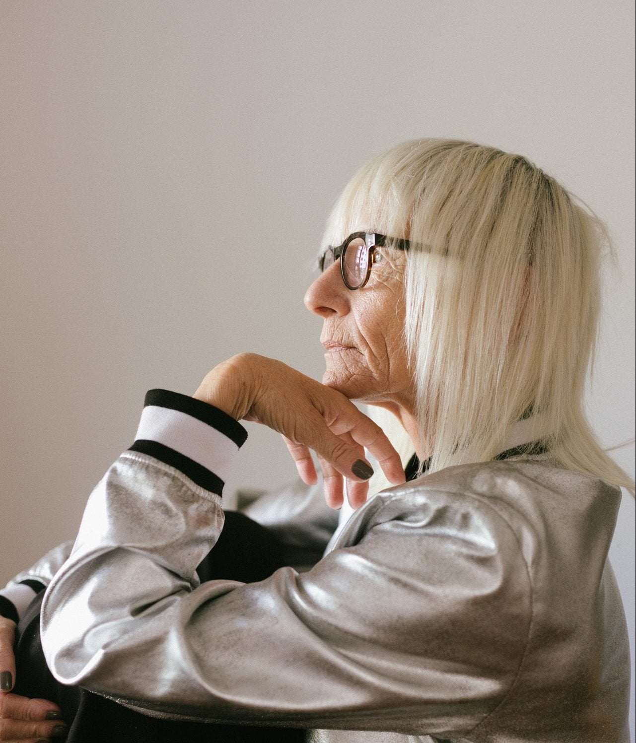 An aged woman sitting down 