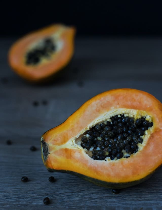 A picture of papaya cut into half 